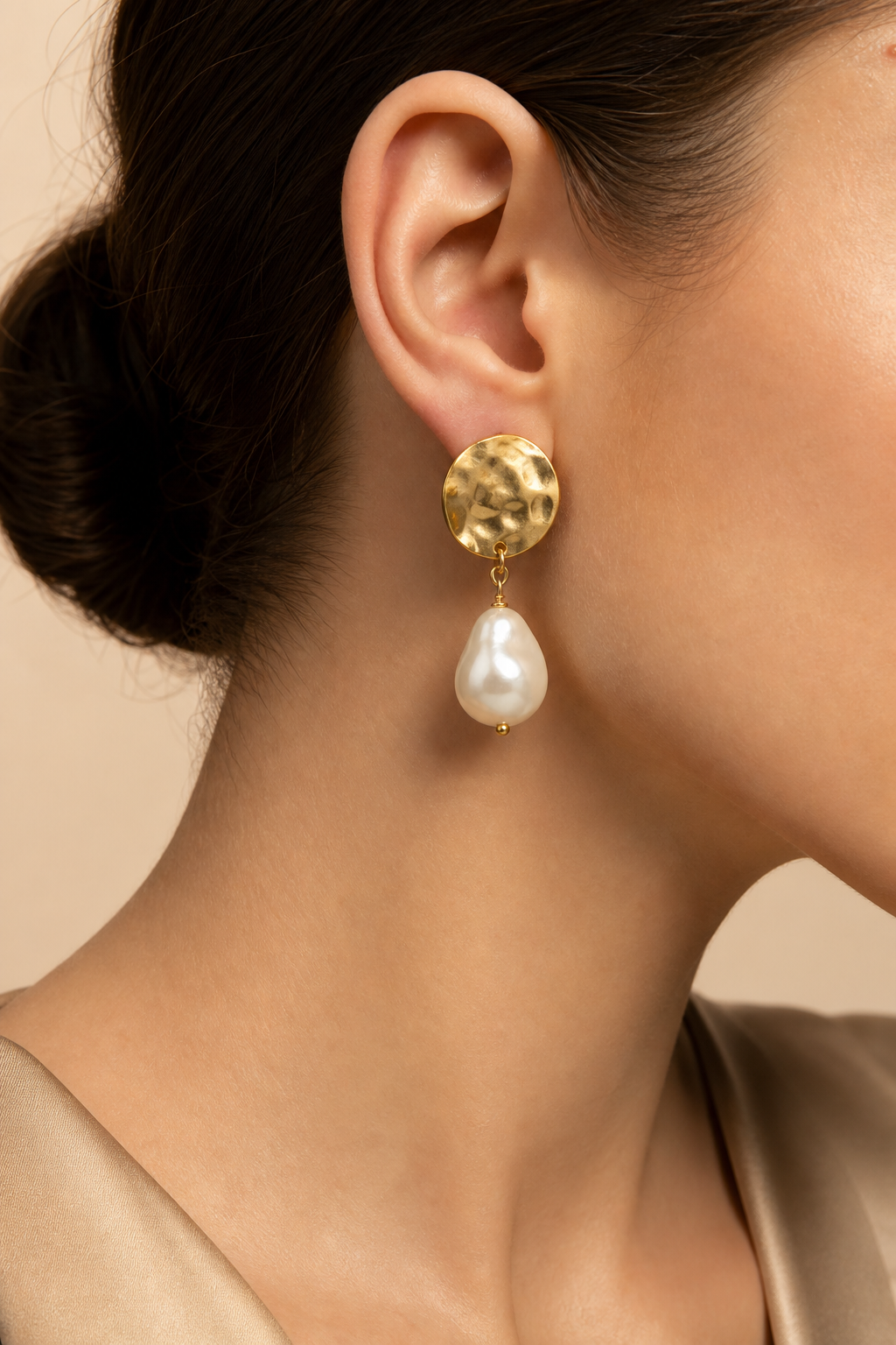 Pearl earring worn on ear